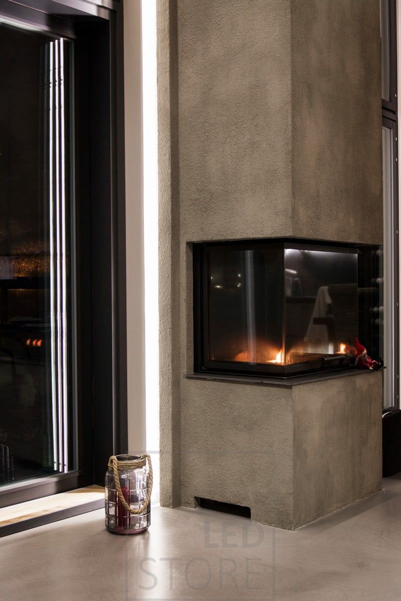 LED strip behind the fireplace to highlight the fireplace and create a moody indirect light. Ledstore.fi